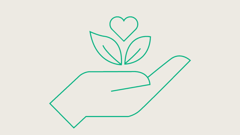 icono verde de la mano con flor por encima